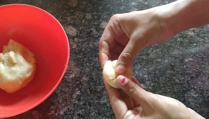 Flatten each ball into a thin disc using your hand, not a rolling pin. Make sure the center is not too thick.