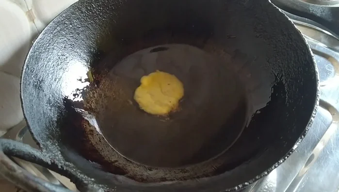 Heat oil in a pan on very low heat.