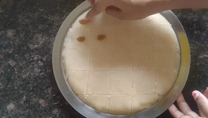 Garnish with raisins or other dry fruits (optional).