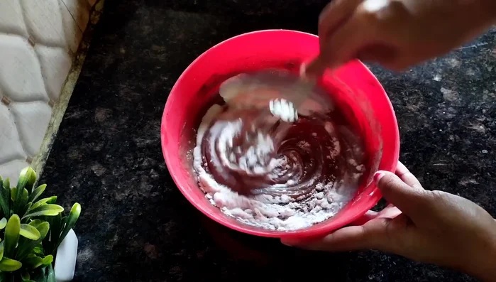 Add milk to the dry ingredients, mixing gently until well combined. The batter should be smooth.