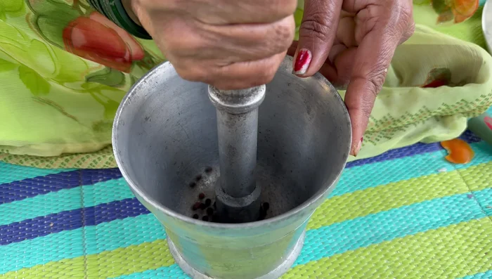 Grind peppercorns into a coarse powder using a mortar and pestle.