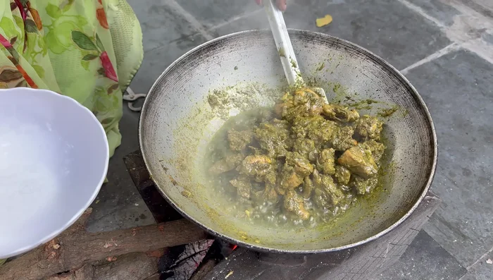 Remove the cooked chicken. Add remaining gravy, coriander powder, chicken masala, and garam masala to the pan; fry briefly.