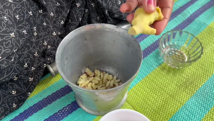 Prepare a ginger-garlic paste by grinding or blending cleaned ginger and garlic.