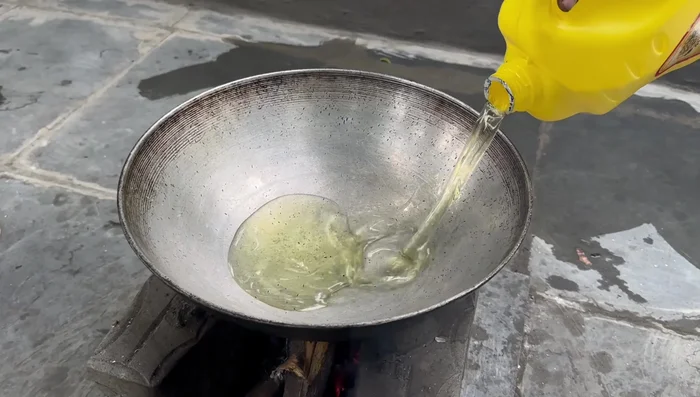 Fry the papads: Heat oil in a pan (234.76) and fry the papads until reddish brown on both sides (260.799).