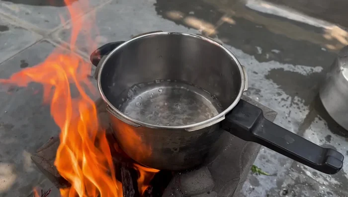 Boil potatoes: Add water to a cooker, bring to a boil (73.68), add potatoes, and cook until 3-4 whistles (90.479).