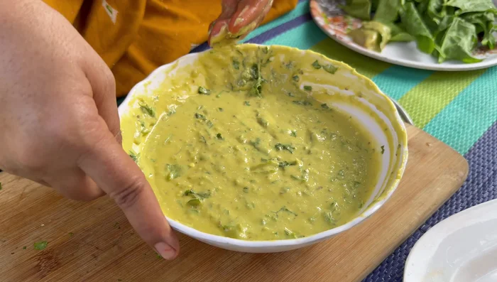 Coat each chicken piece with the mixture, then wrap it in a spinach leaf, and dip it in the mixture again.
