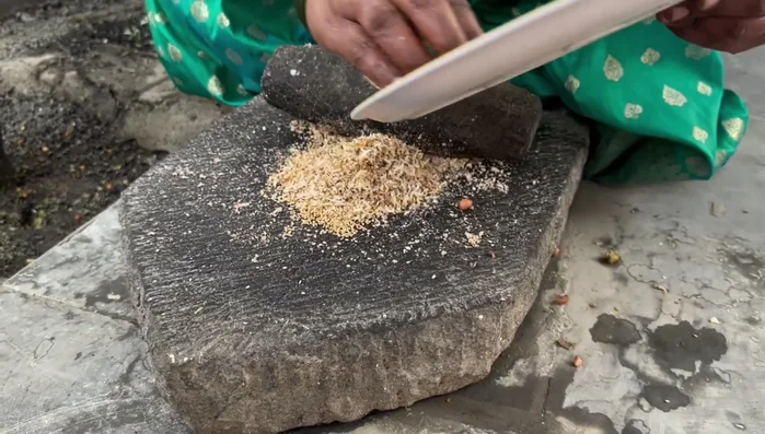 Grind roasted coconut and sesame seeds separately.