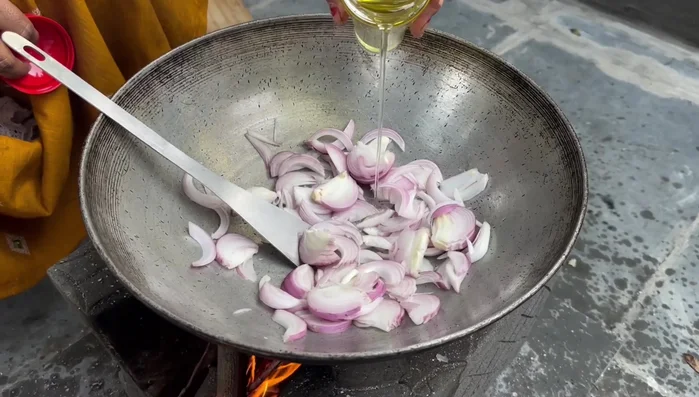 Fry onions in oil until golden brown.