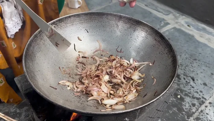 Add and fry garlic and ginger with onions.
