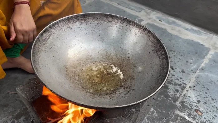 Heat oil in a pan. Add mustard seeds and cumin seeds.