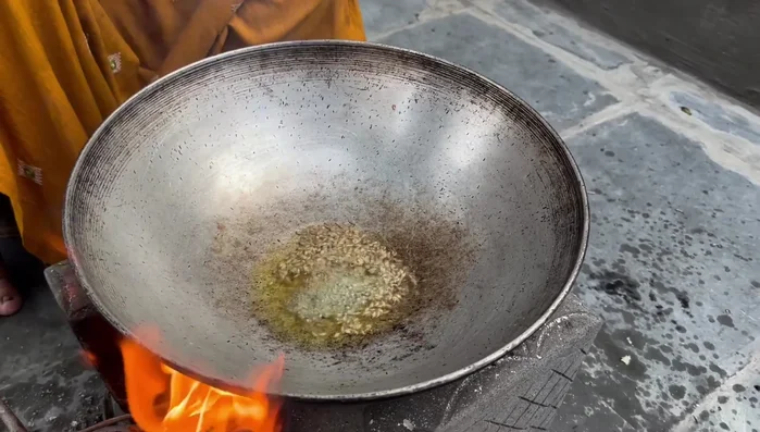 Add fried onion, garlic, ginger mixture and asafoetida.