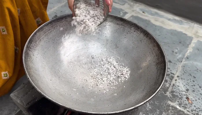 Roast coconut until slightly reddish.