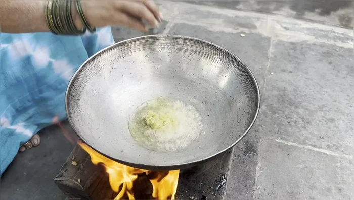 Add ginger-garlic paste and finely chopped onions. Fry until onions turn golden brown.