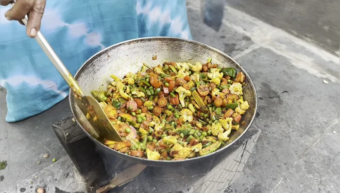 Cover the kadai and steam the vegetables for 10-15 minutes.