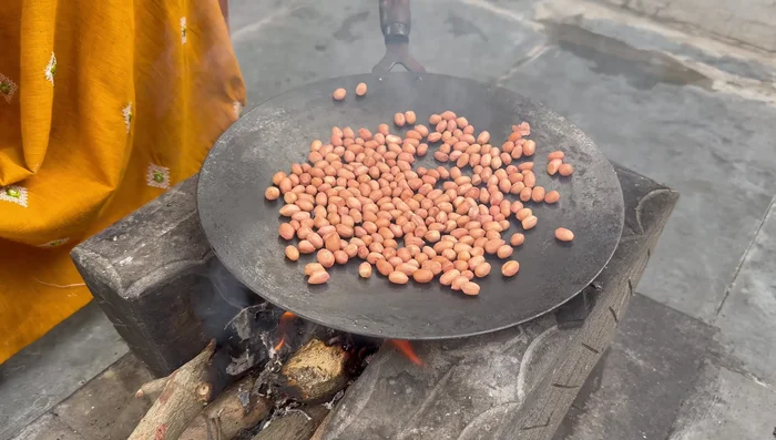 Roast peanuts until crispy.