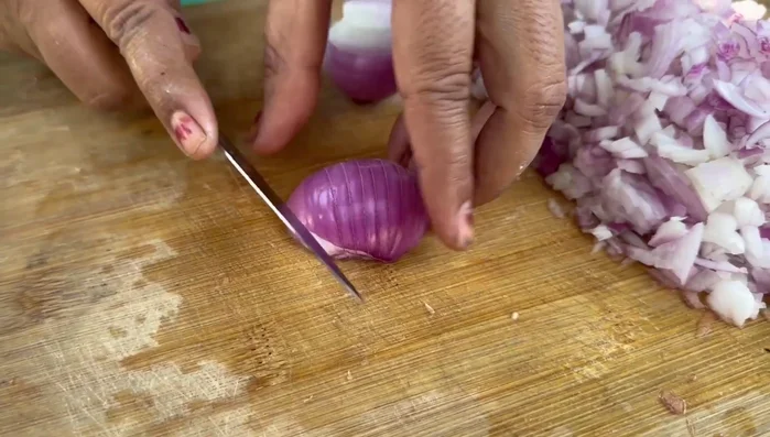 Finely chop onions for the gravy. Cut capsicum into large pieces.