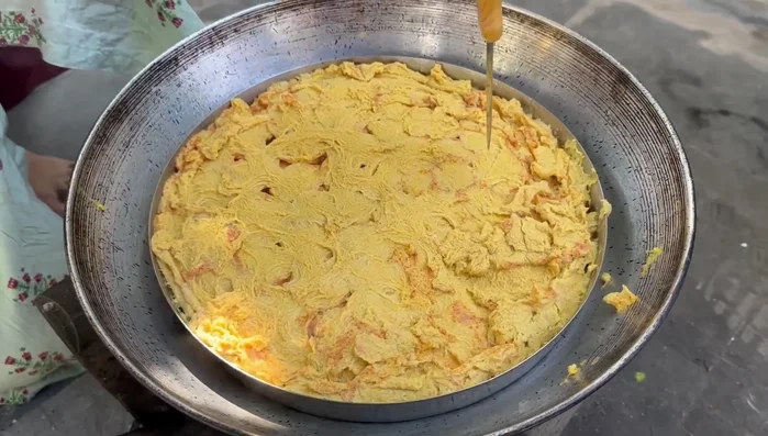 Once the egg tikkis are cooked, remove them and let them cool. Cut them into small, square pieces.