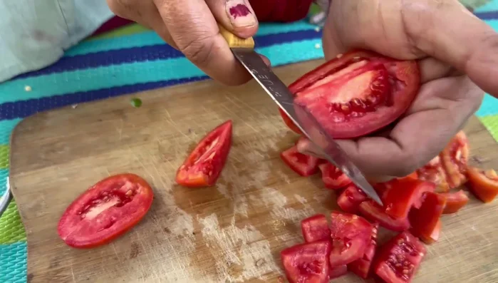 Cut tomatoes into large pieces, reserving some for the gravy.