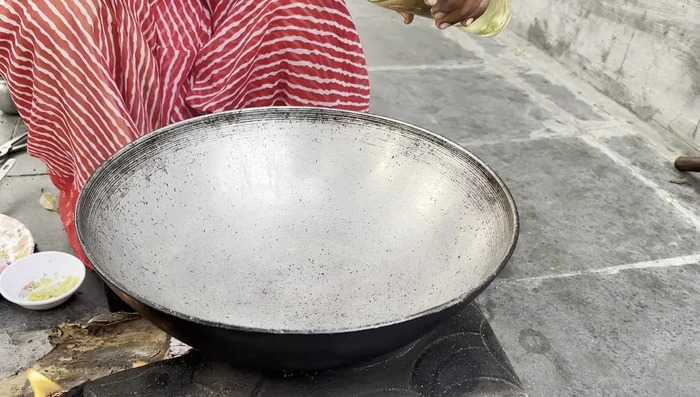 Prepare ragda by sautéing onions in oil, then adding ginger-garlic paste, tomatoes, and spices. Add cooked peas and simmer.