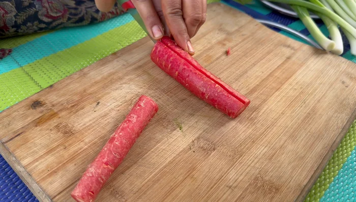 Chop vegetables (carrots, onions, bell peppers) into small pieces.