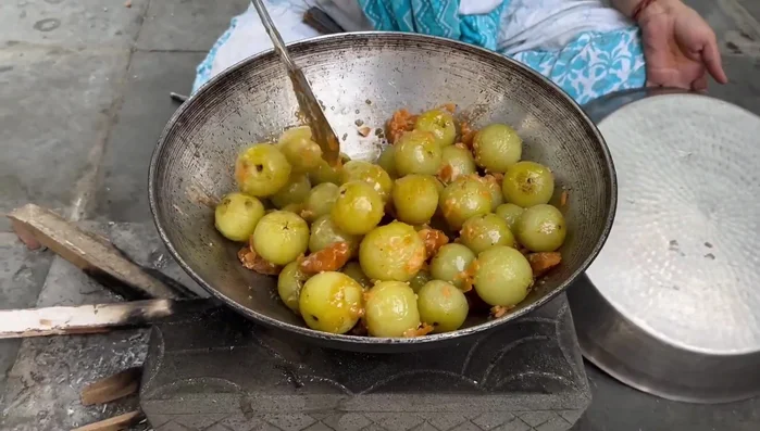 Mix the jaggery and sugar until a paste forms. This may take some time.