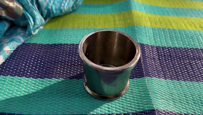 Add cardamom and a little sugar to help with grinding.