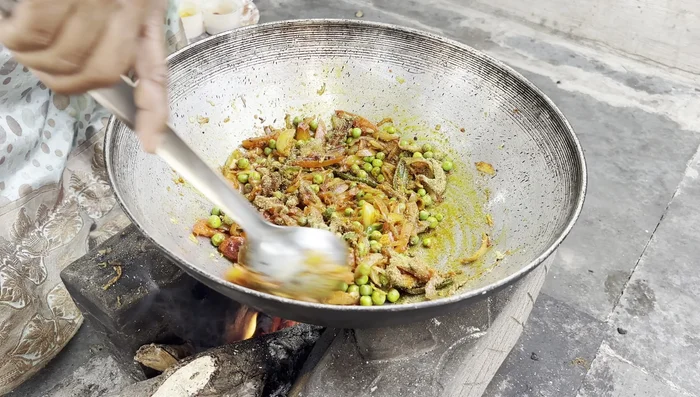Once the cooker has cooled down, open it and remove the cooked cabbage and potatoes.