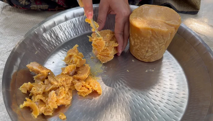 Break the jaggery into small pieces using a knife.