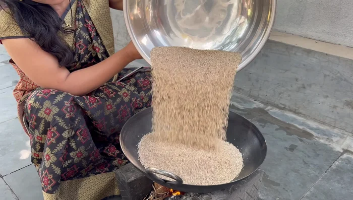 Roast sesame seeds in a large kadhai. If your kadhai is small, roast in batches.