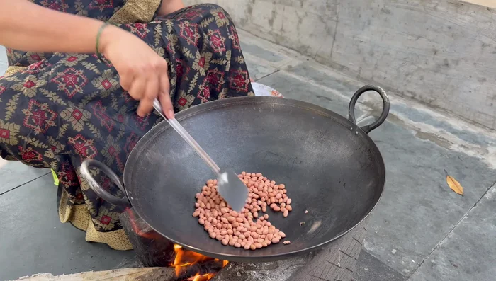 Roast peanuts in the same kadhai.