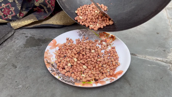 Remove peanut skins and grind peanuts to a fine powder.