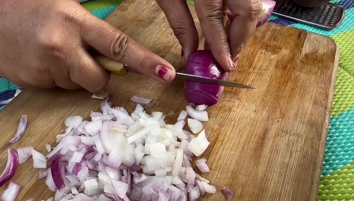 Finely chop the onion, tomato, and coriander.