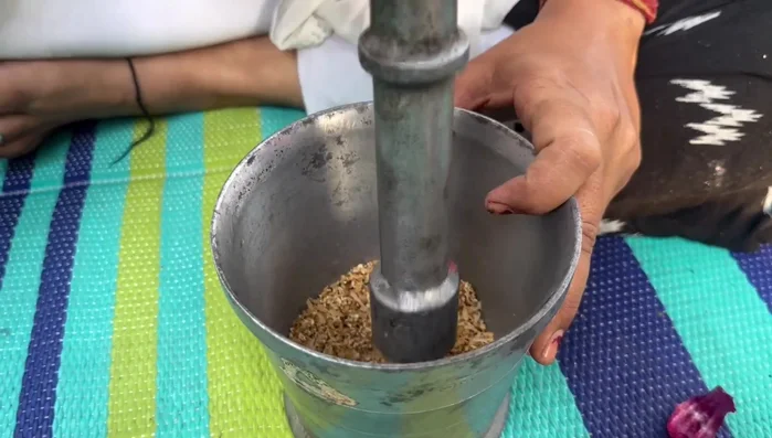 Grind the roasted poppy seeds, sesame seeds, and coconut into a paste.