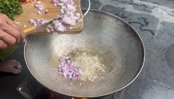 Heat oil in a pan, add mustard seeds and cumin seeds. Add chopped onions and fry until red.