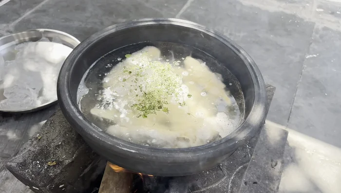 Cook the soya chap batter, adding spices gradually.
