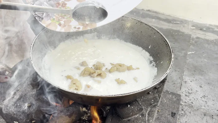 Combine the fried soya chap and gravy; add salt, sugar, and simmer.