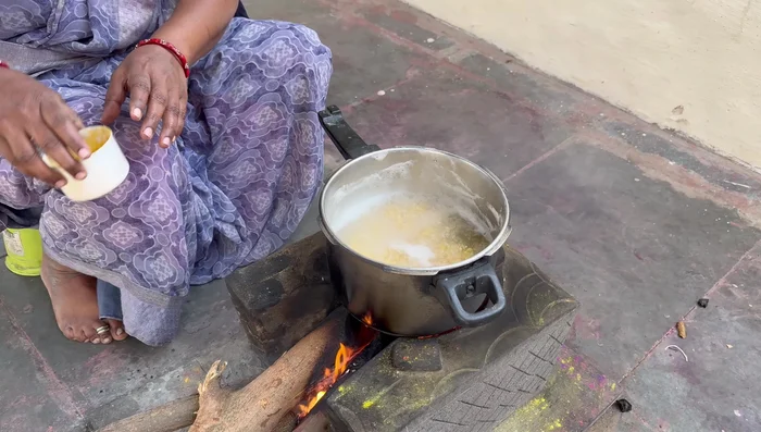 Once cooked, add turmeric powder (1/2 tsp) and salt (1/2 tsp) to the dal. Cook for 2 whistles.