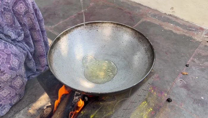 Heat oil and ghee in a pan. Add chopped onions and cumin seeds, fry until golden.