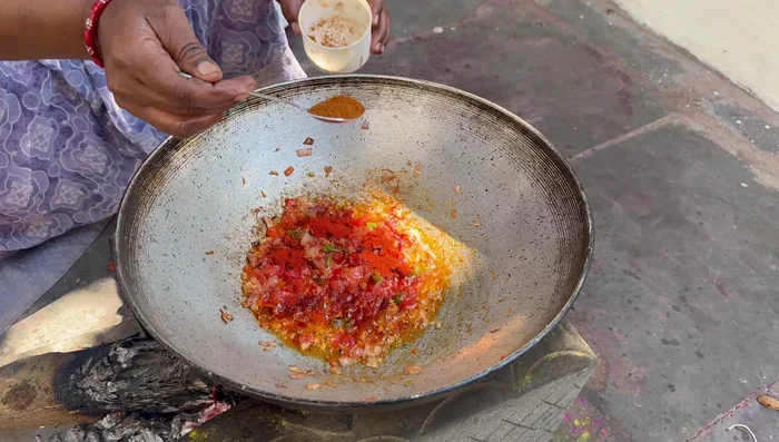 Add red chili powder, garam masala, coriander powder, and a little more turmeric powder. Mix well.