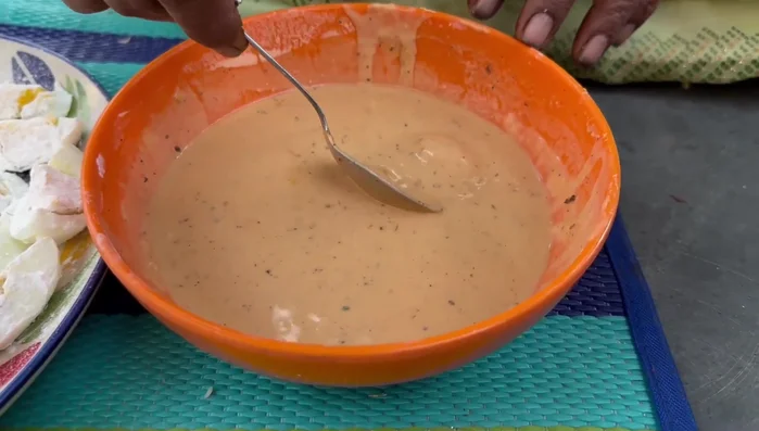 Coat the beaten egg whites with cornflour.