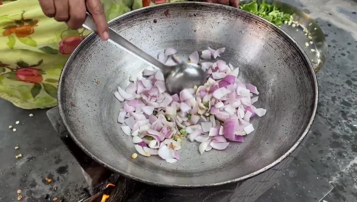 Add onions and capsicum, fry until softened.