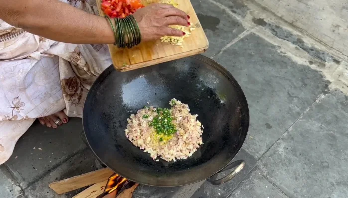 Add the green chilies and finely chopped garlic. Saute until cooked.
