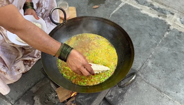 Add the whole Maggi noodles to the boiling water.