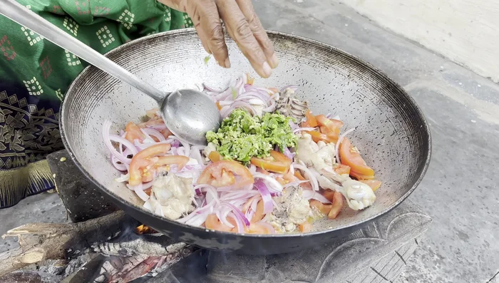 Mix everything well and fry until the onions and tomatoes are soft and cooked.