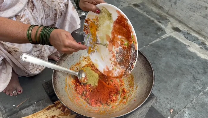 Add turmeric powder, coriander powder, red chili powder, and other spices. Fry well.