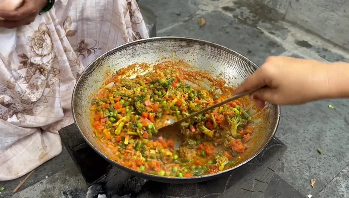 Combine all the sautéed vegetables with the prepared gravy. Add salt to taste and mix well.