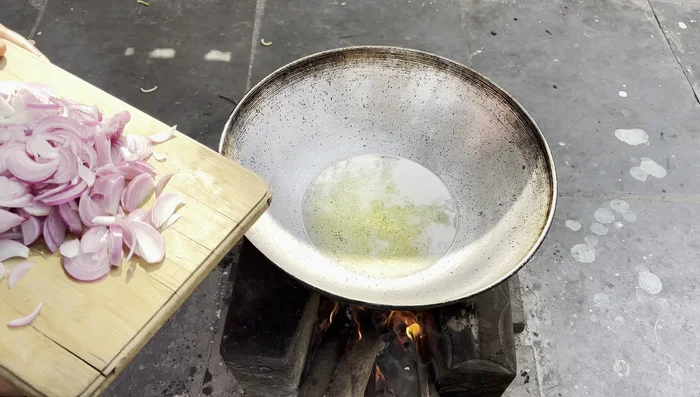 Fry the onions in hot oil until golden brown.