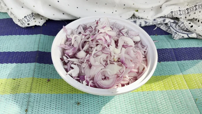Add salt to the chopped onions; let it sit for 5-10 minutes to drain water.