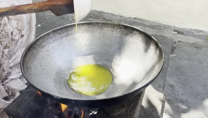 Heat ghee in a pan. Add the sieved flour and fry for 10-12 minutes, stirring continuously, until it's well-roasted and light brown in color.
