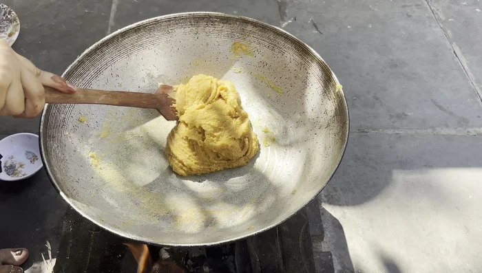 Grease a bowl with ghee. Pour the mixture into the bowl and let it cool completely (2-3 hours).